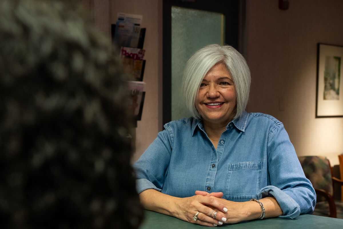 Dental hygienist providing patient care and hygiene instruction for implant maintenance