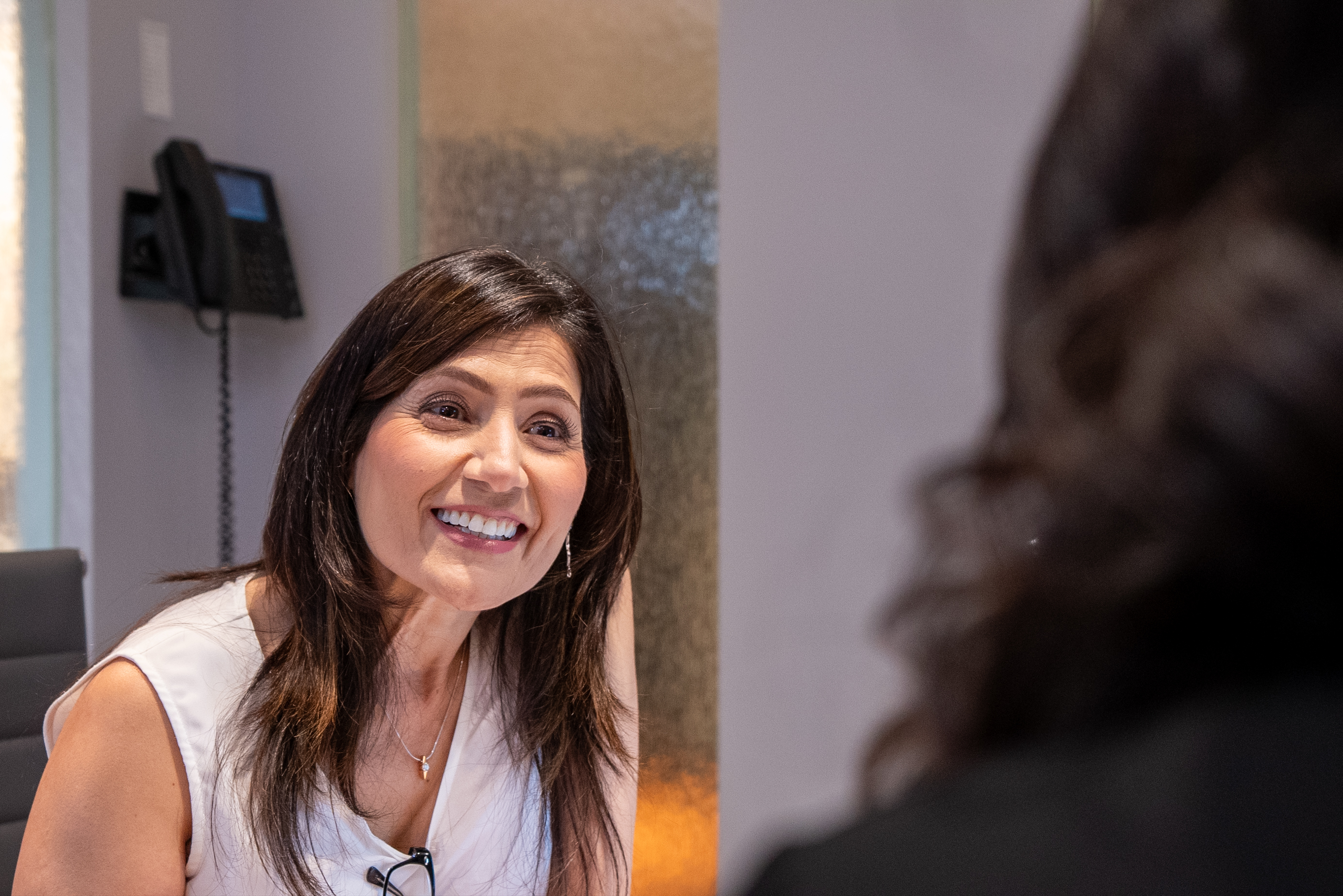 Dental implant care team member at Elite Prosthetic Dentistry providing professional cleaning and maintenance