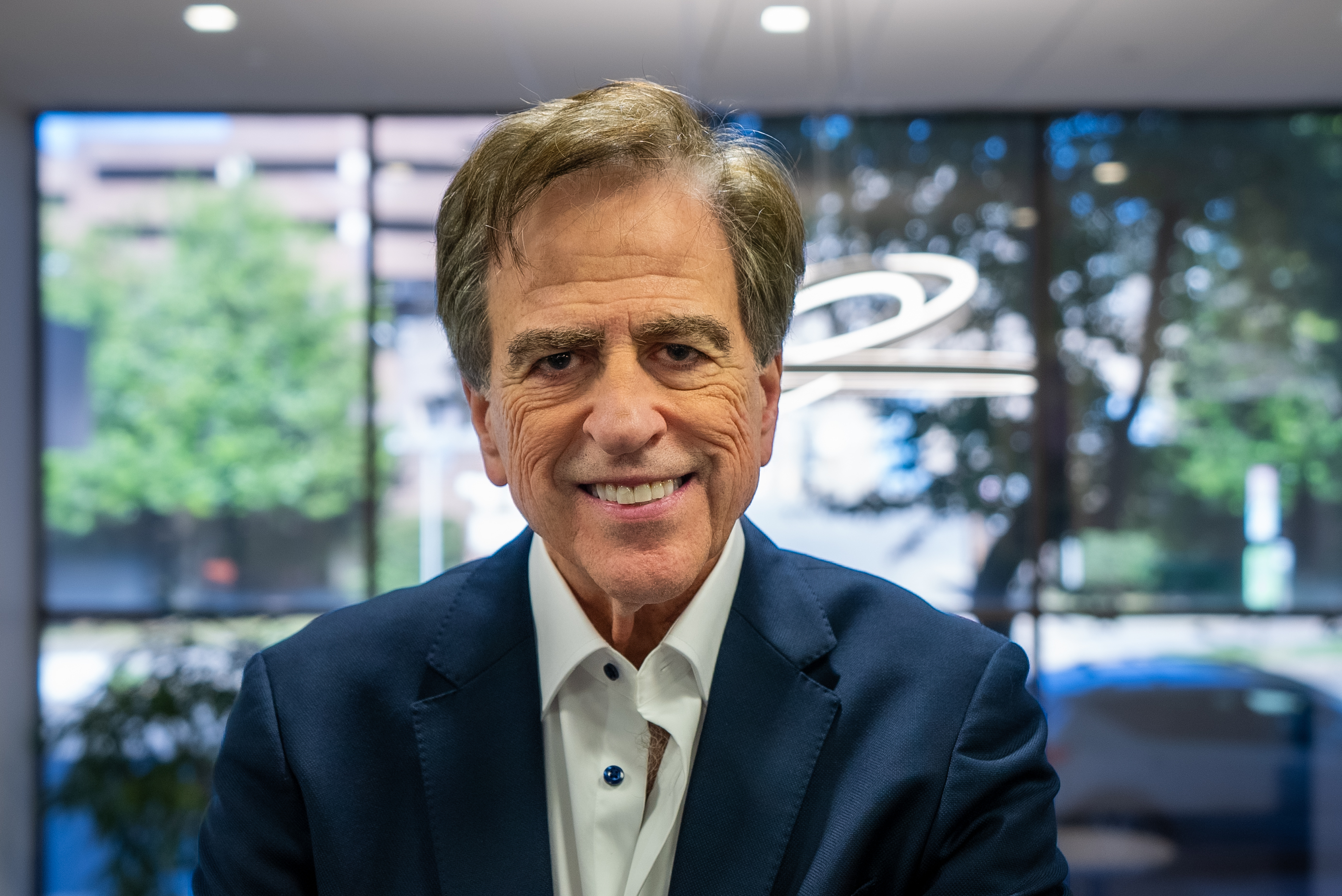 Dr. Gerald Marlin discussing dental implant treatment options during a consultation near Bethesda MD