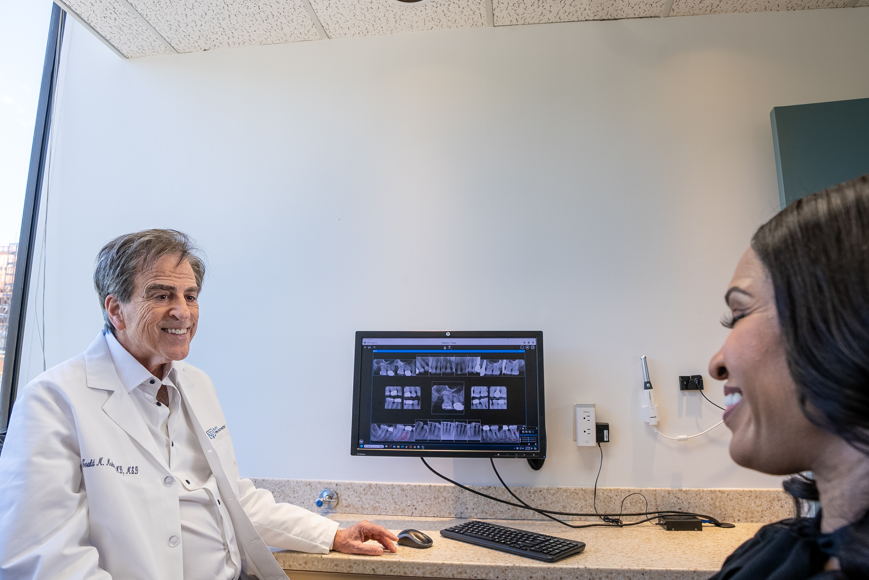 Dr. Gerald Marlin discussing full arch implant treatment planning with Bethesda patient